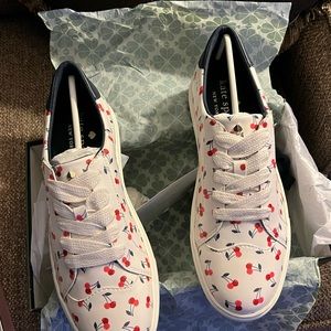 Brand new Kate Spade Keds tennis shoes in the box.